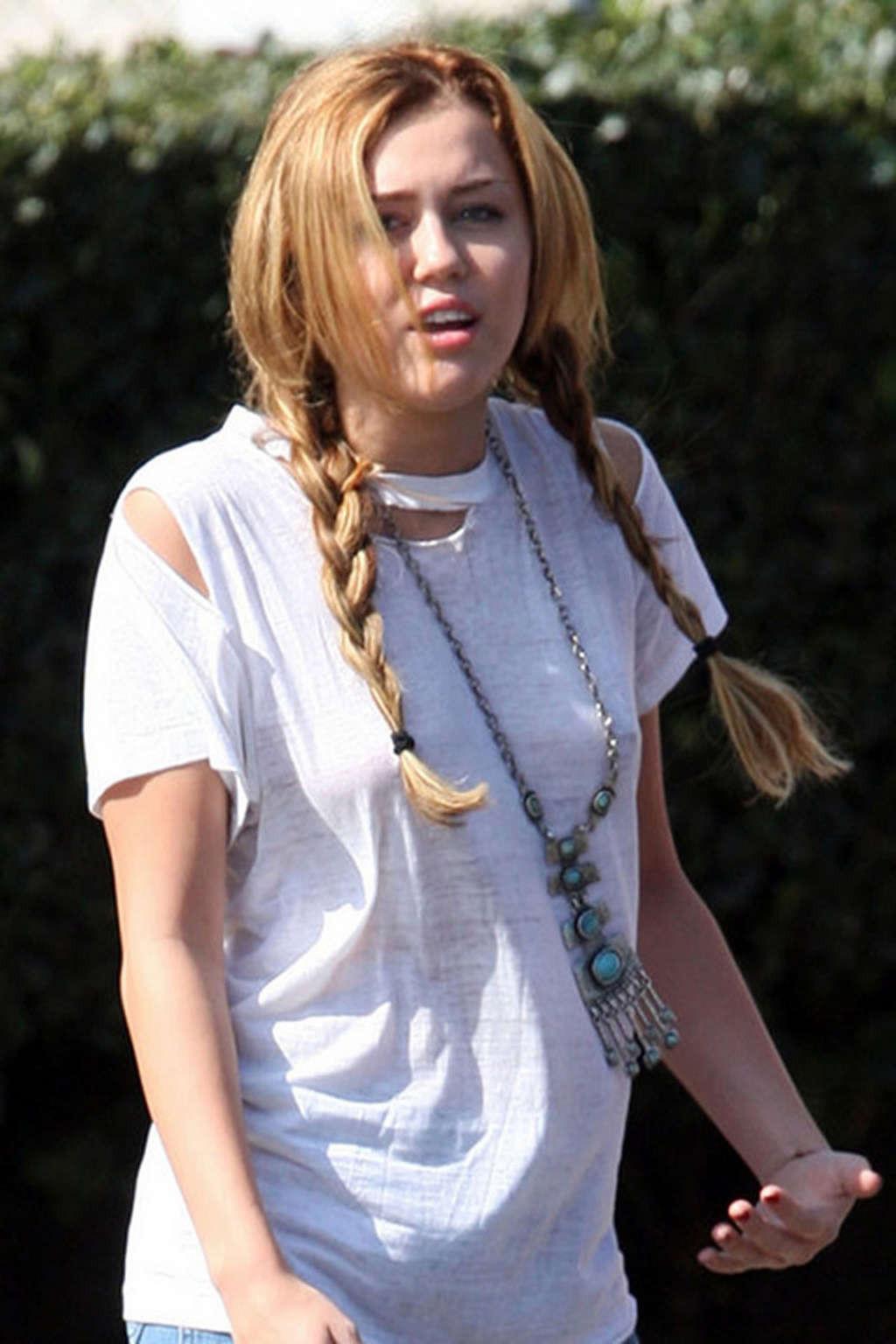 16P Miley Cyrus exposing sexy legs in shorts and hard nipples on street