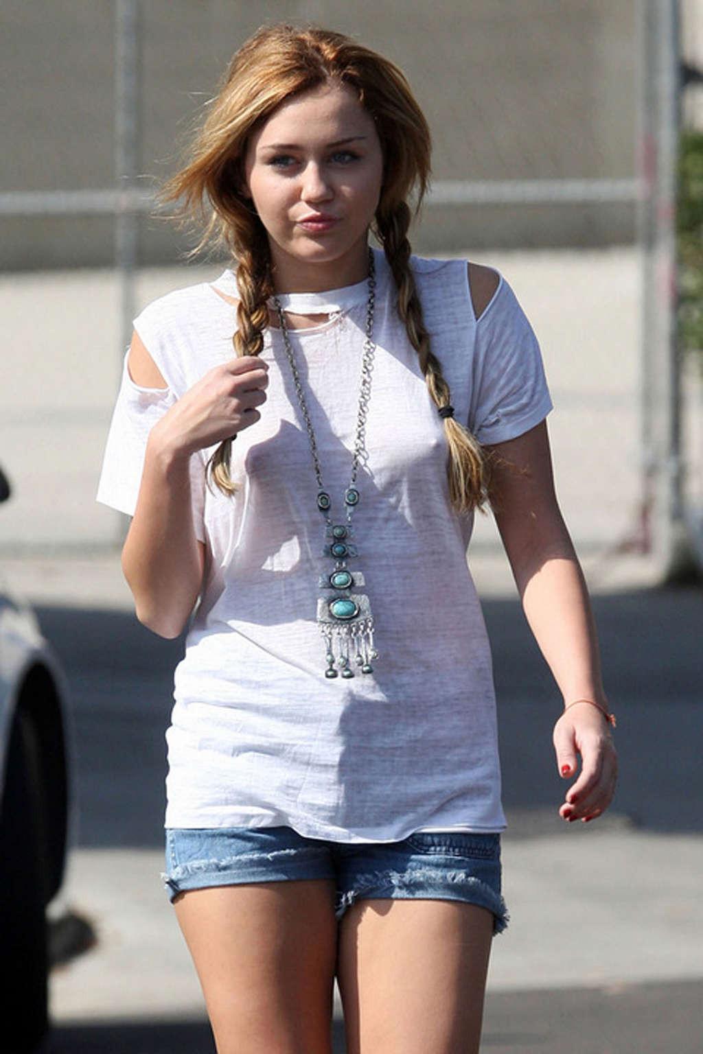 16P Miley Cyrus exposing sexy legs in shorts and hard nipples on street