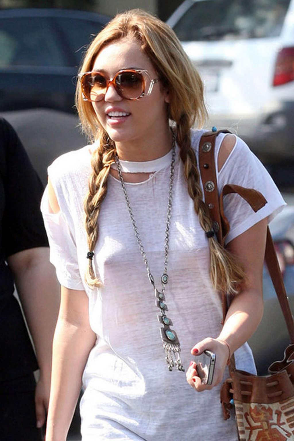 16P Miley Cyrus exposing sexy legs in shorts and hard nipples on street