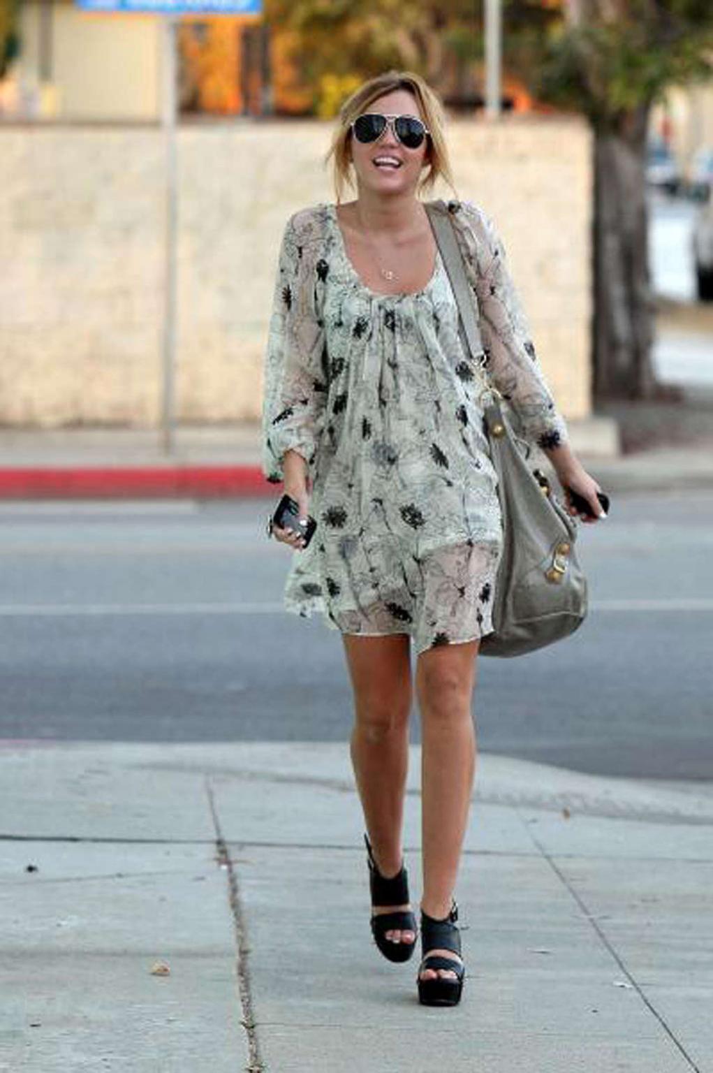 10P Miley Cyrus showing her sexy body and hot legs in skirt on street