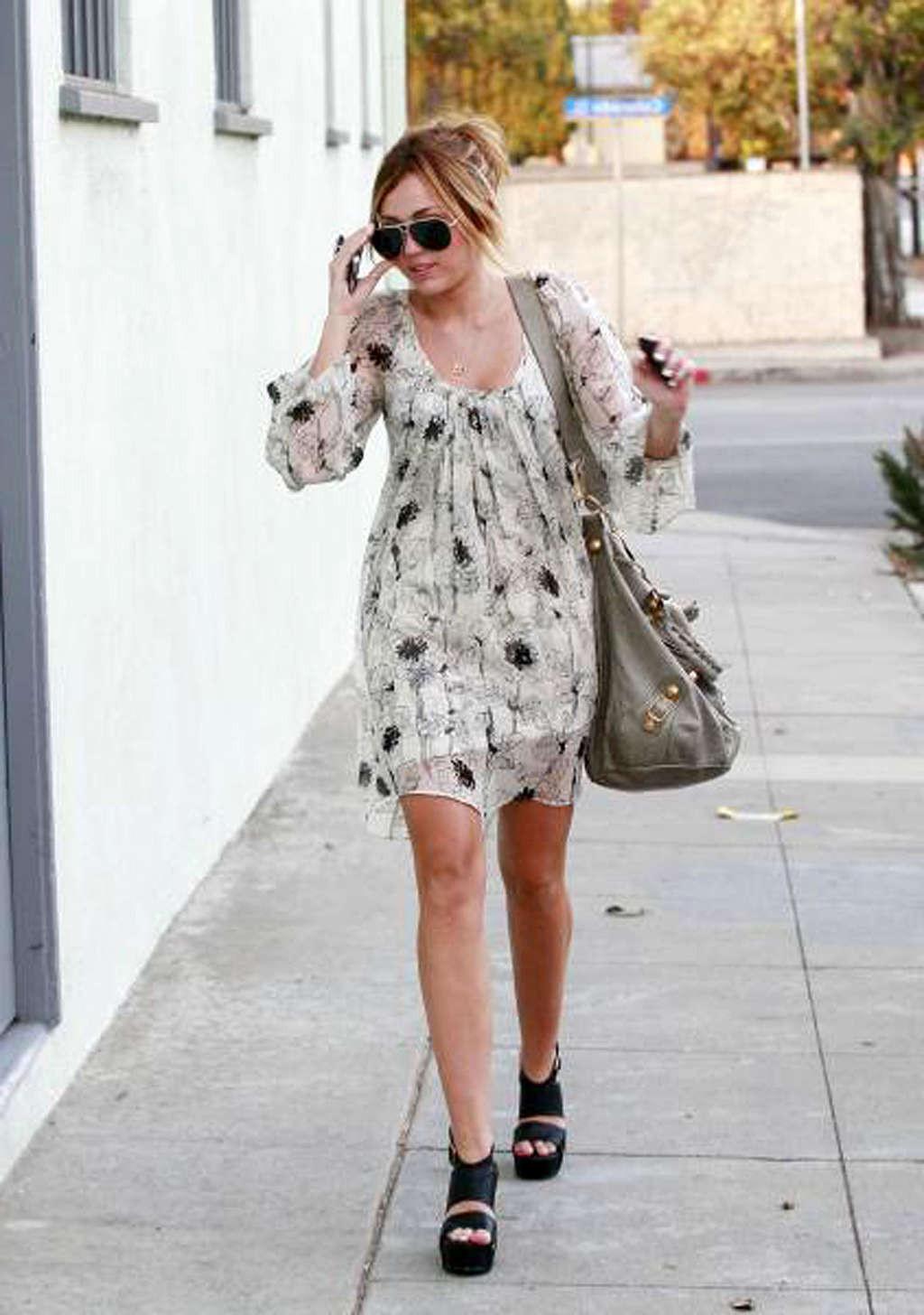 10P Miley Cyrus showing her sexy body and hot legs in skirt on street