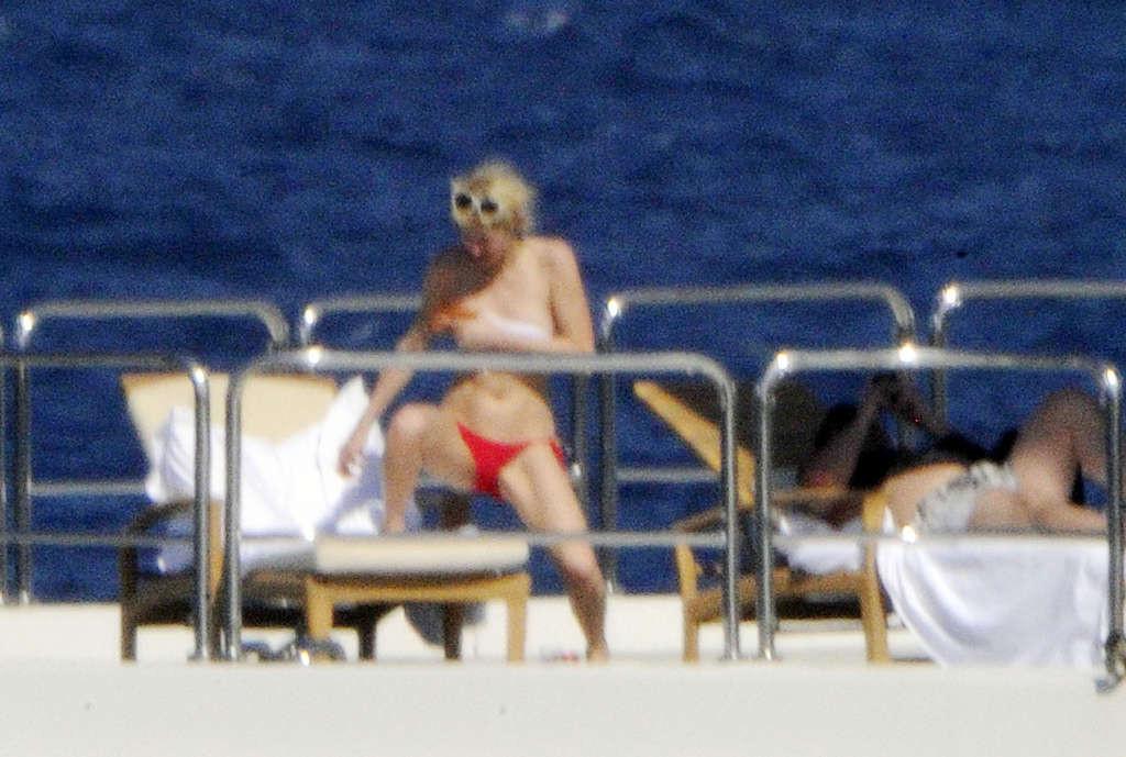 10P Paris Hilton flashing her panties upskirt on street and exposing her tits on yac