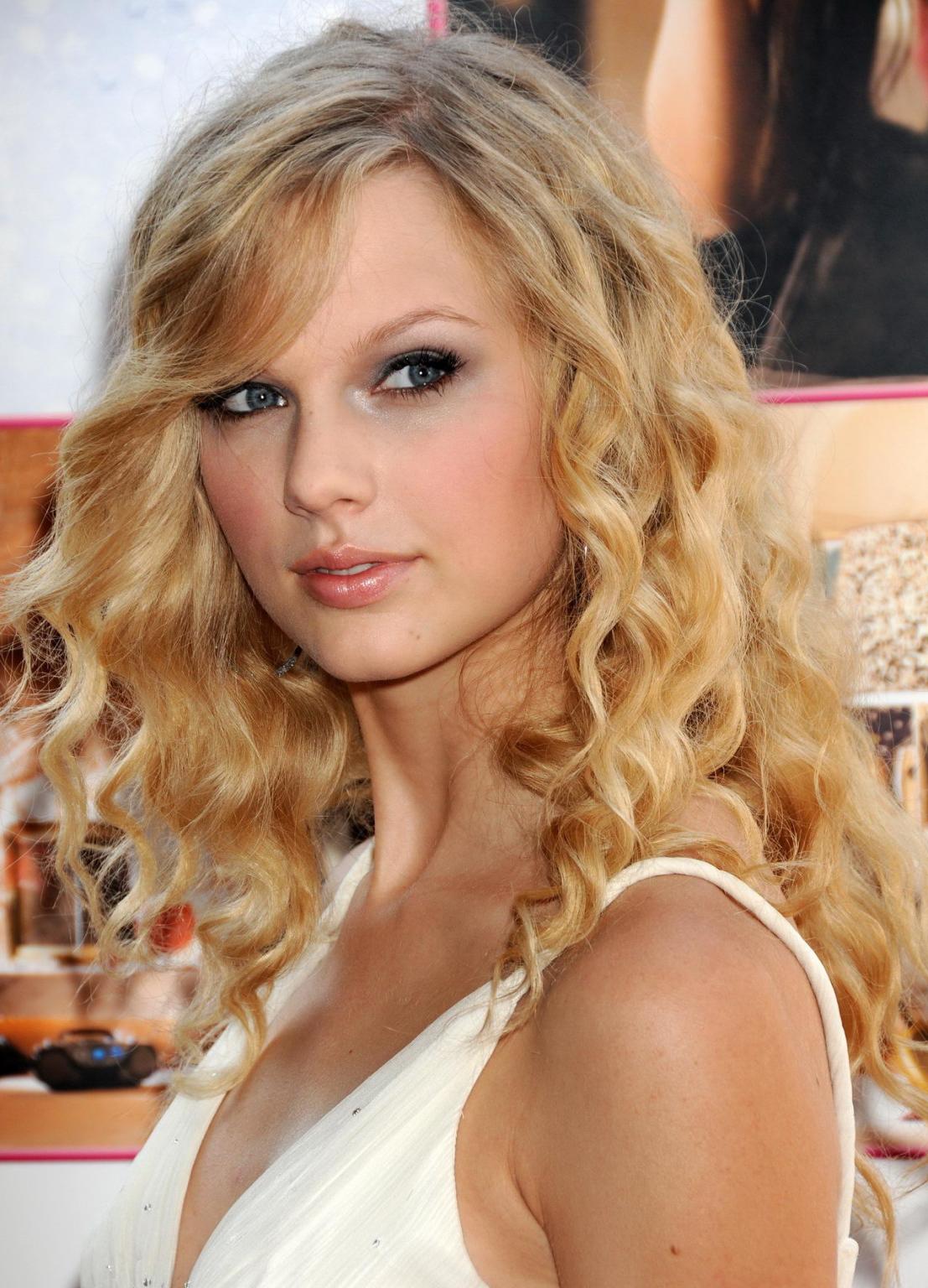 15P Taylor Swift stunning in white dress at 'Another Cinderella Story' premiere