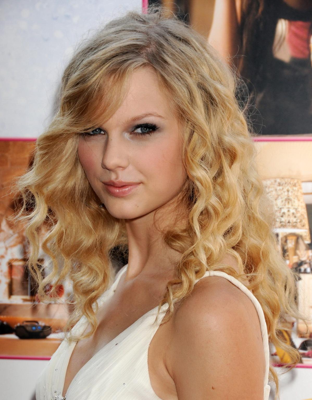 15P Taylor Swift stunning in white dress at 'Another Cinderella Story' premiere