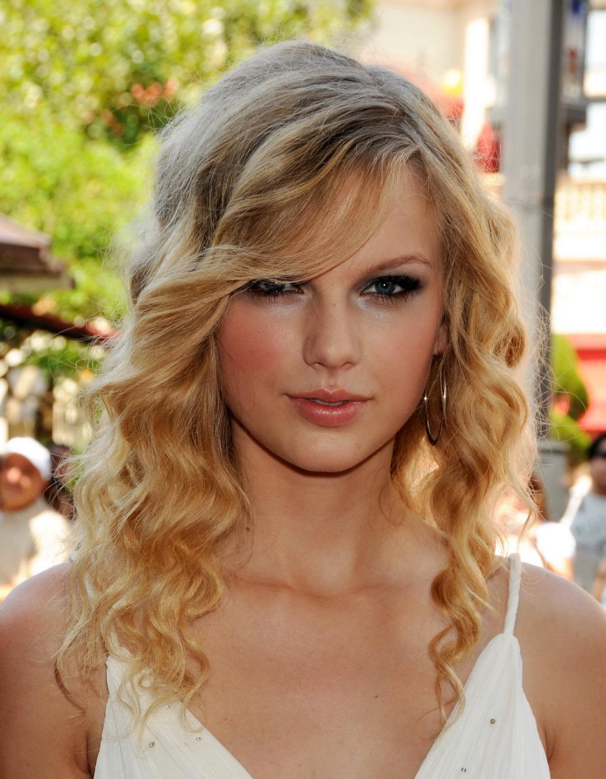 15P Taylor Swift stunning in white dress at 'Another Cinderella Story' premiere