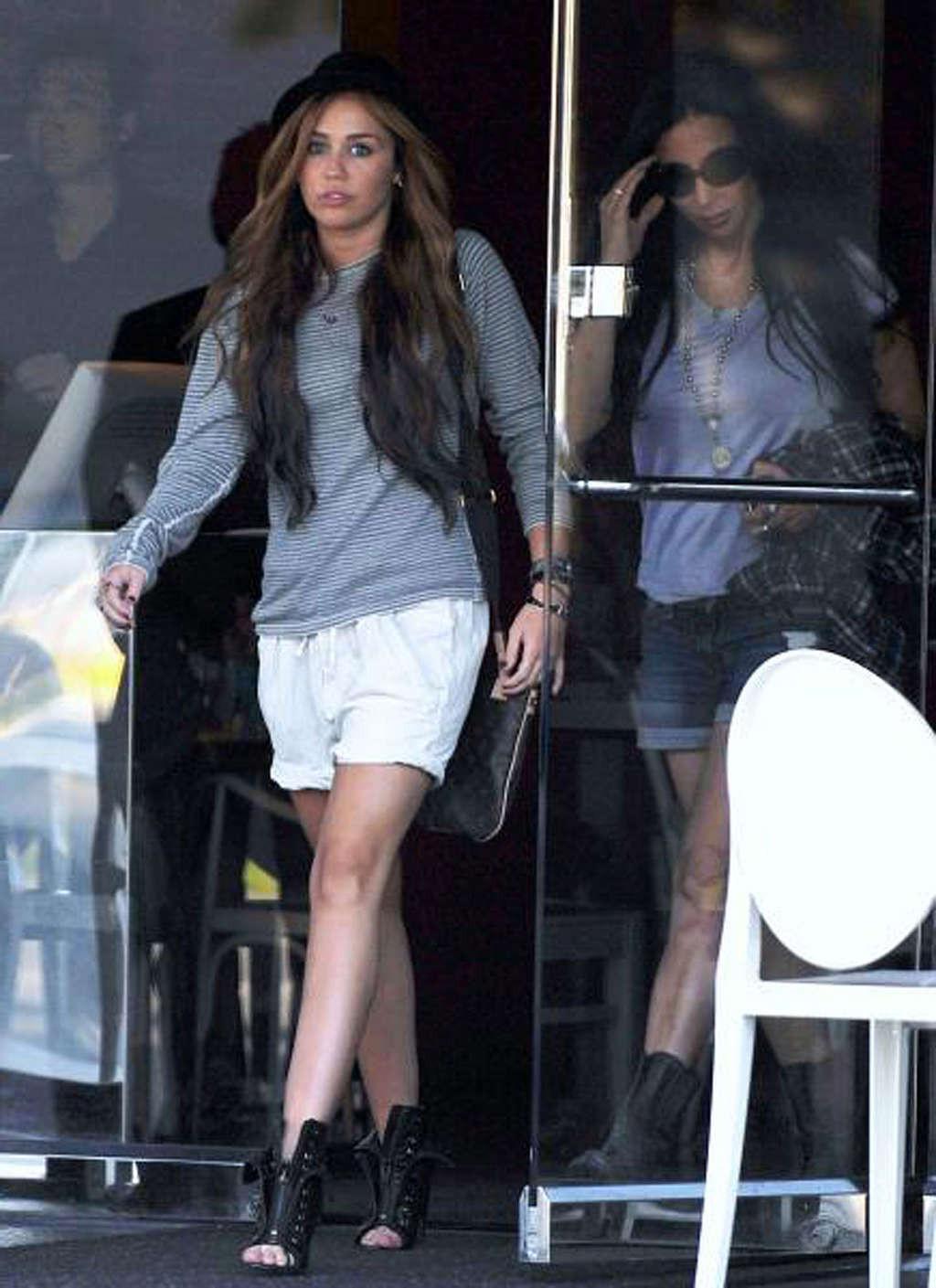 16P Miley Cyrus exposing her hot body and sexy legs on street