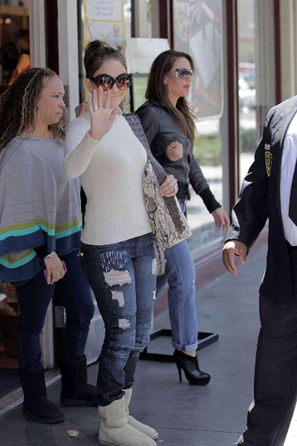 16P Jennifer Lopez walking on street and showing fantastic tits