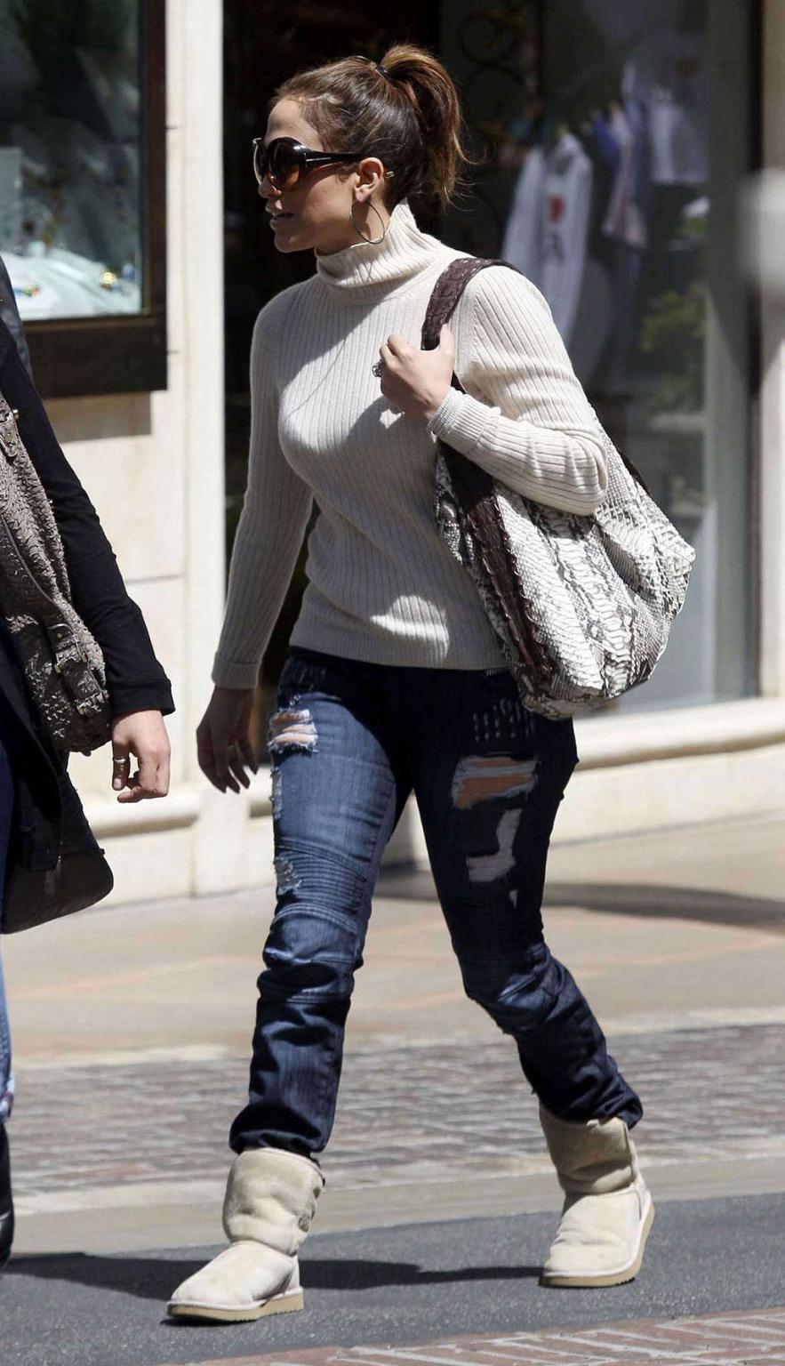 16P Jennifer Lopez walking on street and showing fantastic tits