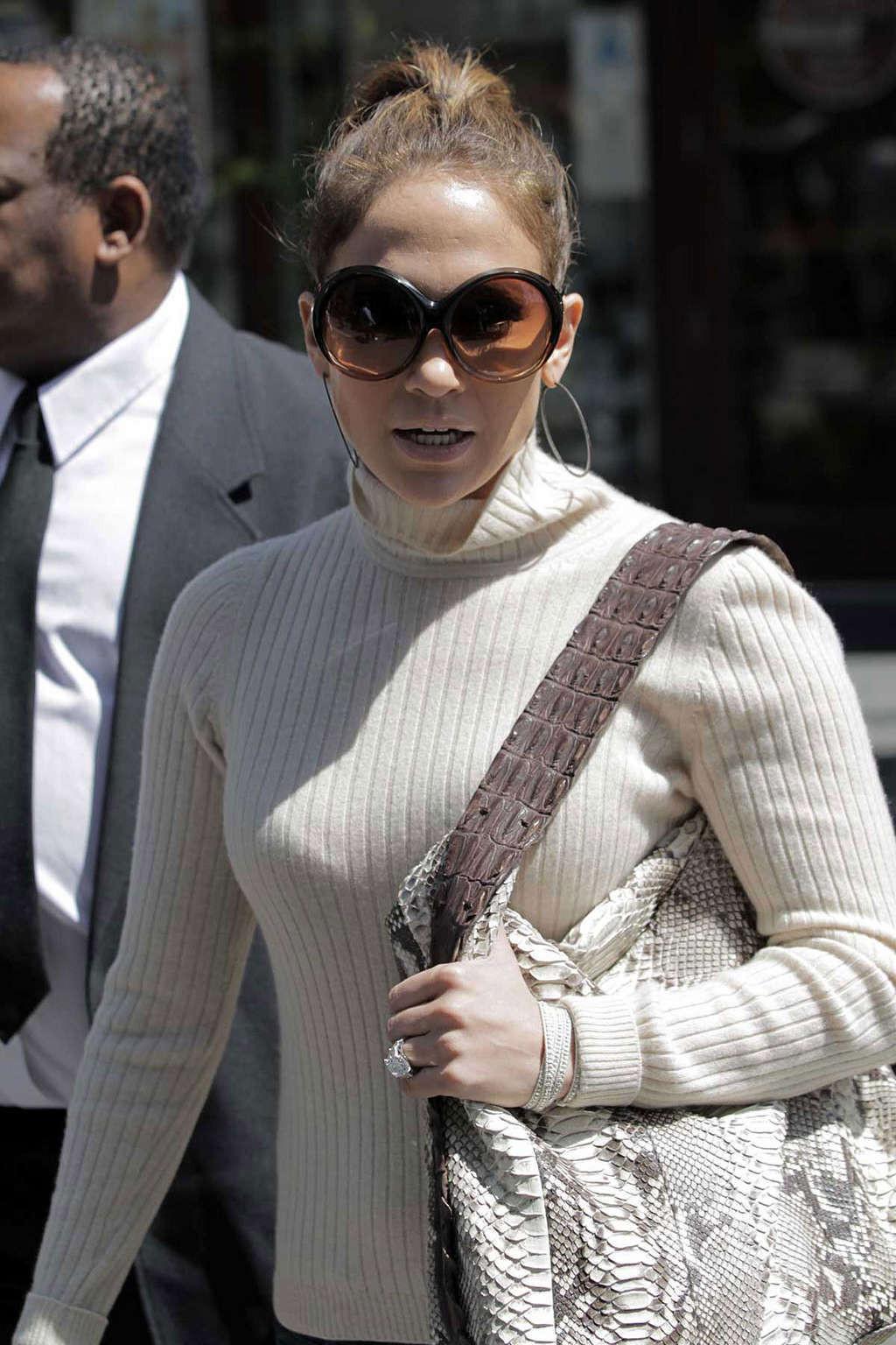 16P Jennifer Lopez walking on street and showing fantastic tits