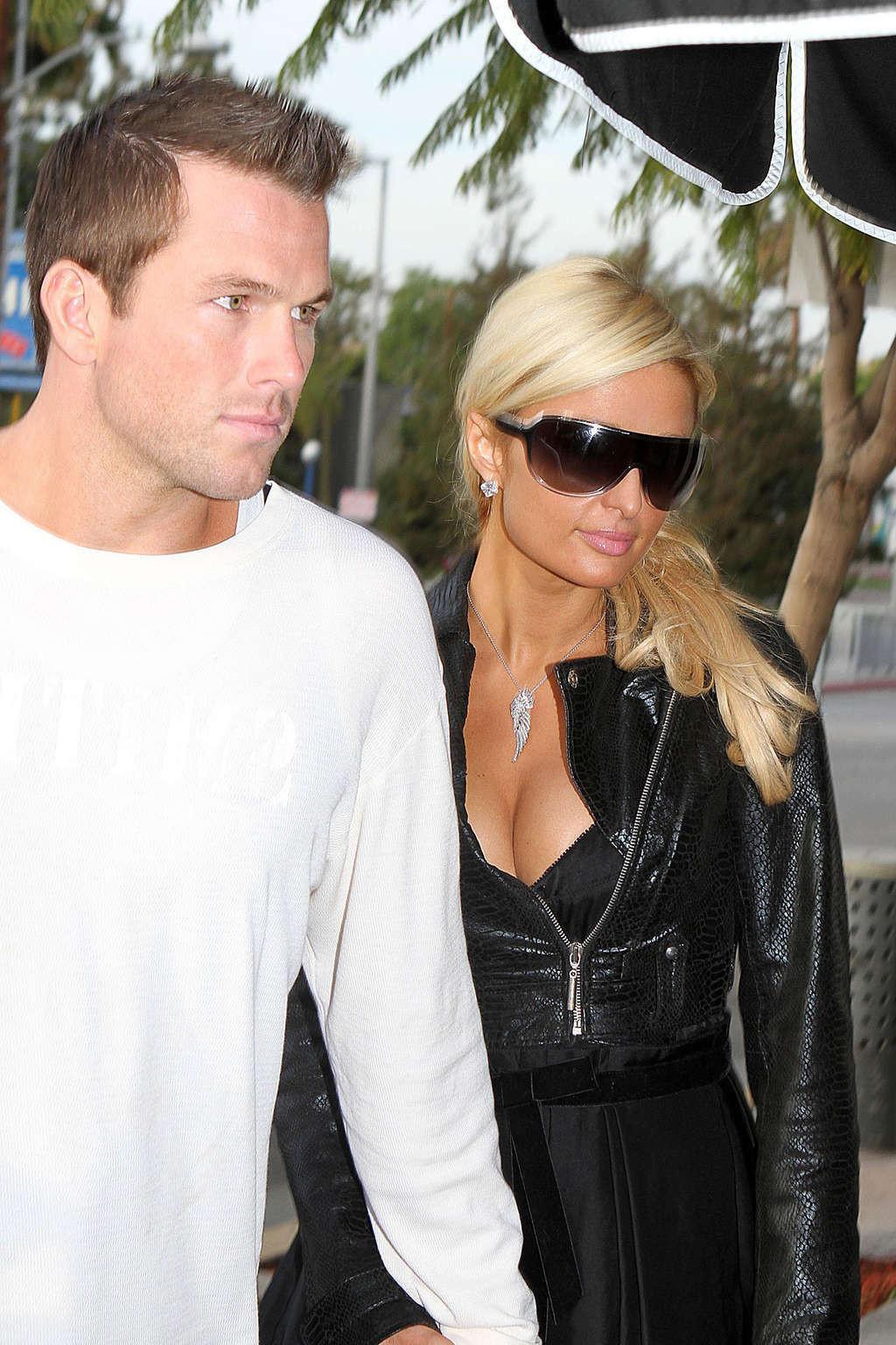 16P Paris Hilton in stockings and dress on street paparazzi shoots