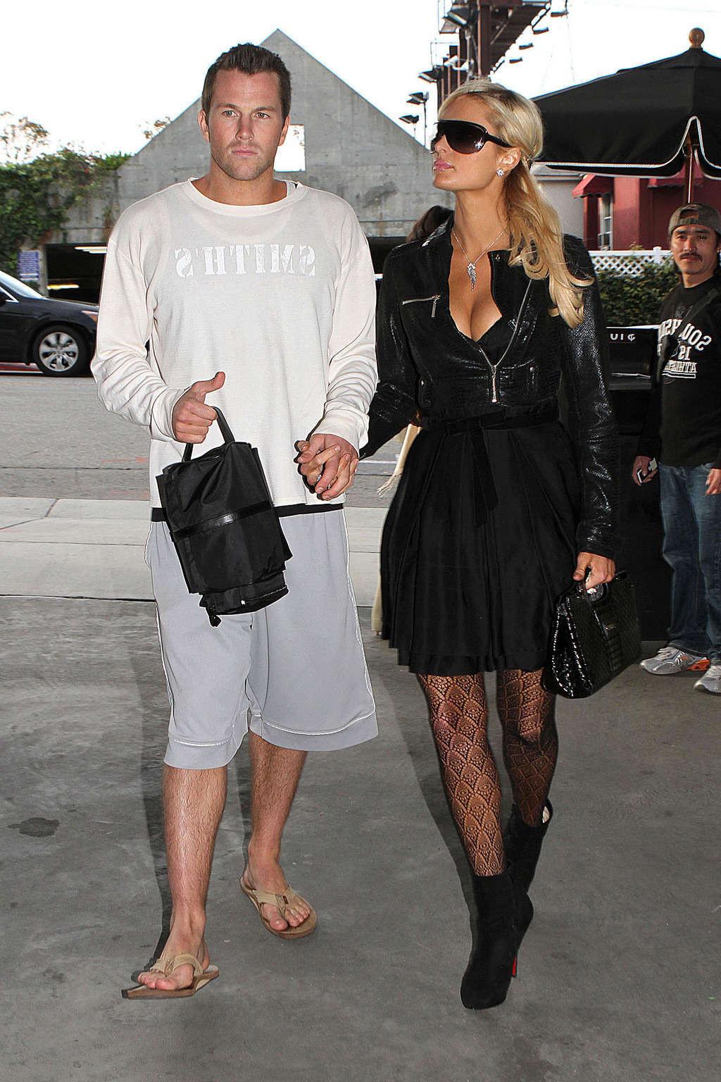 16P Paris Hilton in stockings and dress on street paparazzi shoots