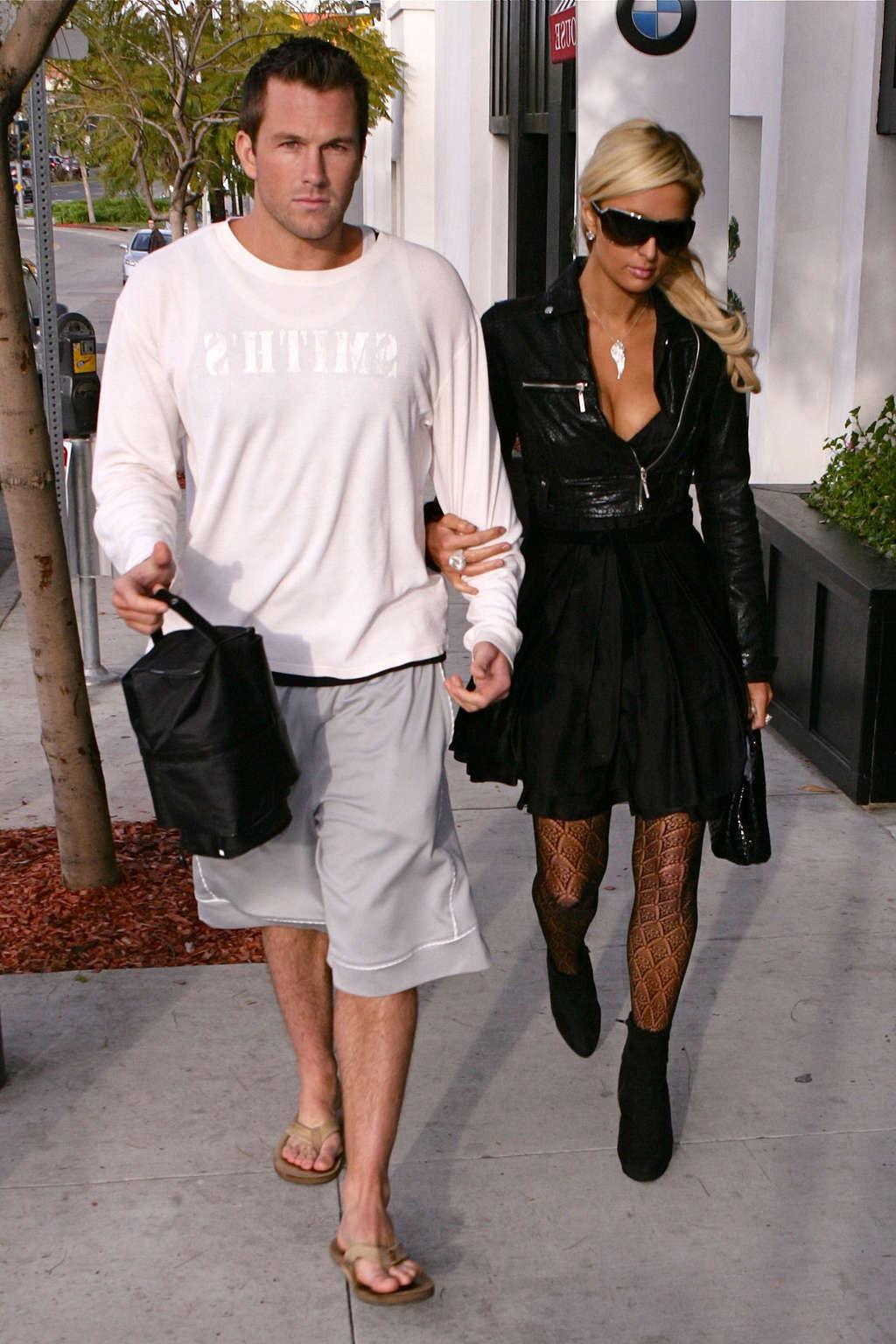 16P Paris Hilton in stockings and dress on street paparazzi shoots
