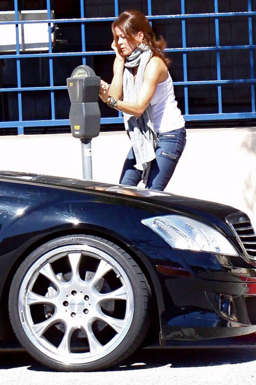 16P Brooke Burke showing her sexy legs in jeans on street