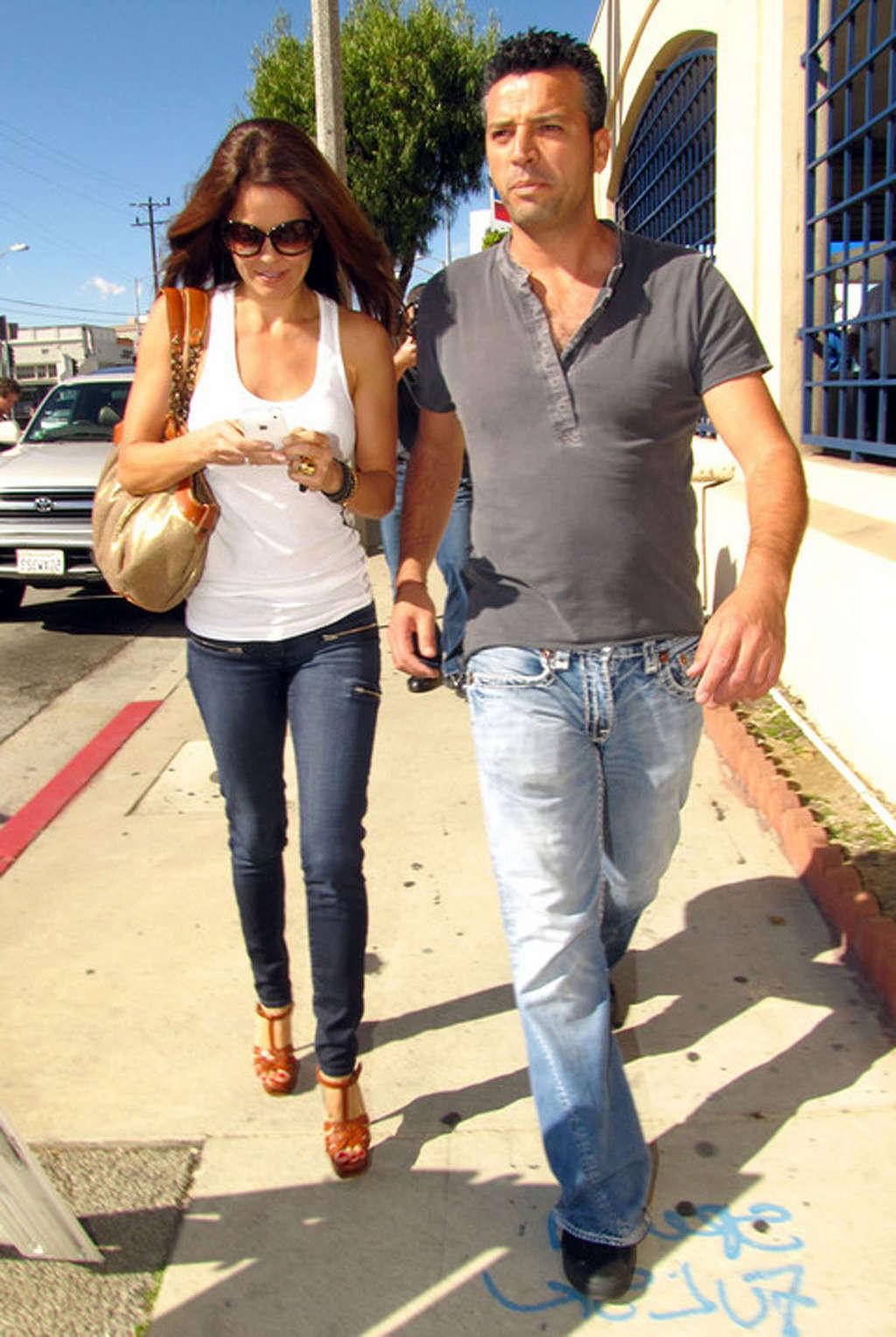 16P Brooke Burke showing her sexy legs in jeans on street