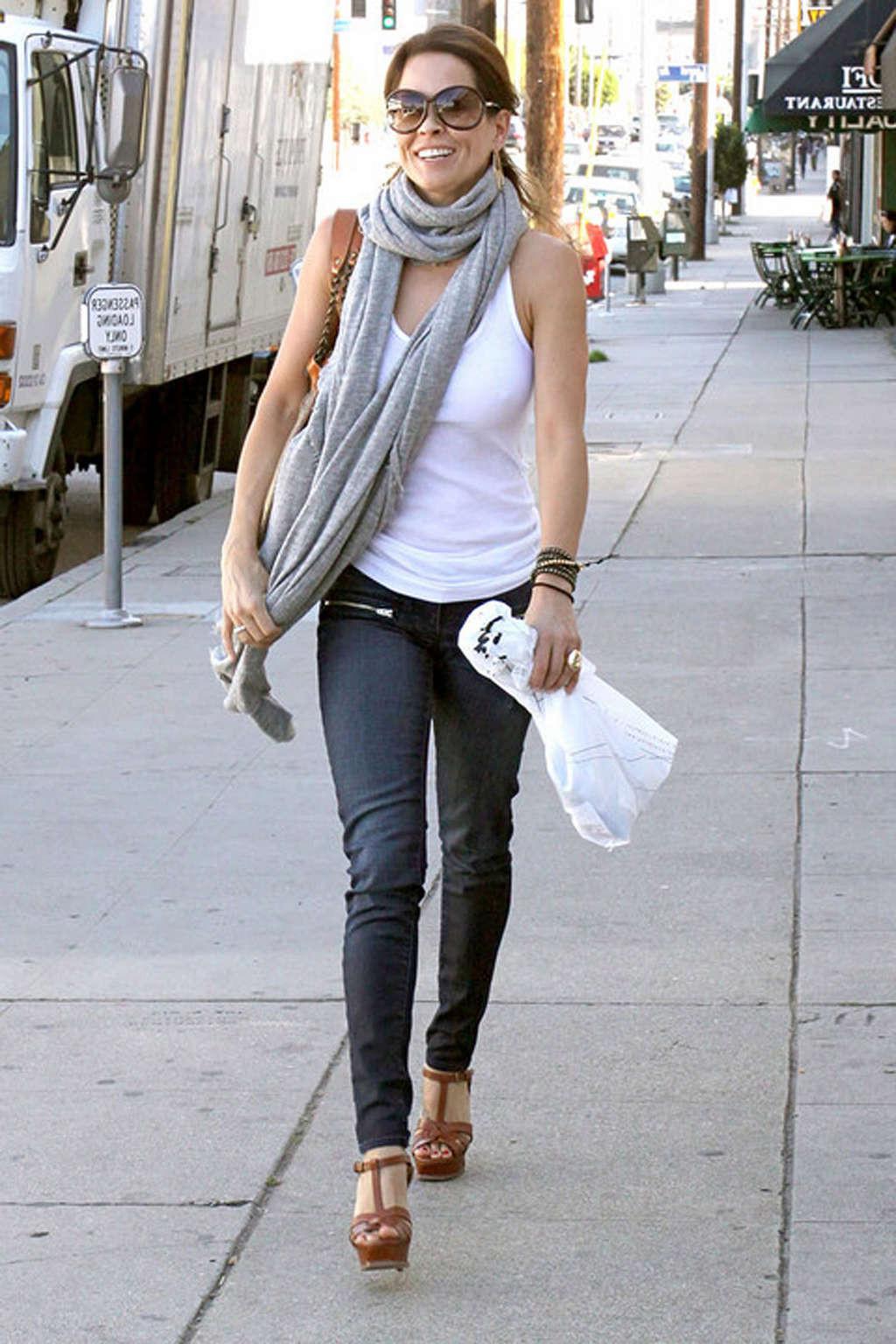 16P Brooke Burke showing her sexy legs in jeans on street