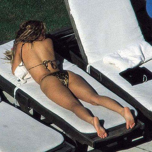 10P Shakira posing in bikini and mini skirt and boots