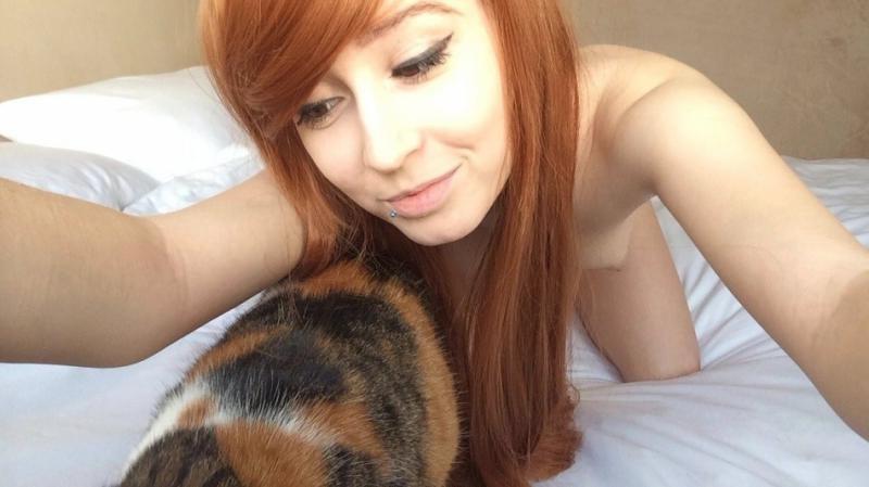14P Naughty cocktease with body piercings posing naked