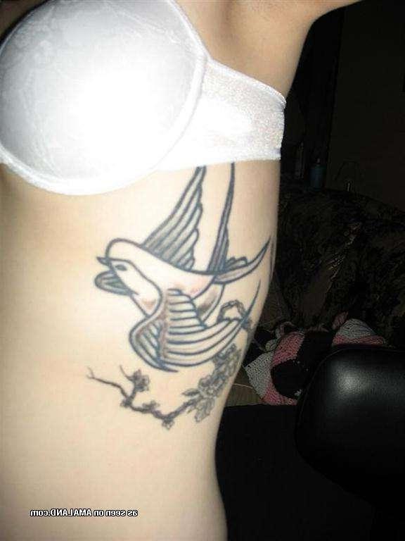 9P Gallery of a sexy inked honey flashing her tits at home