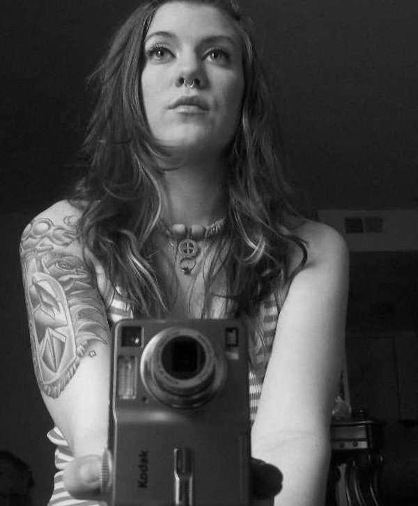 16P Pictures of a rocker girl displaying her tits