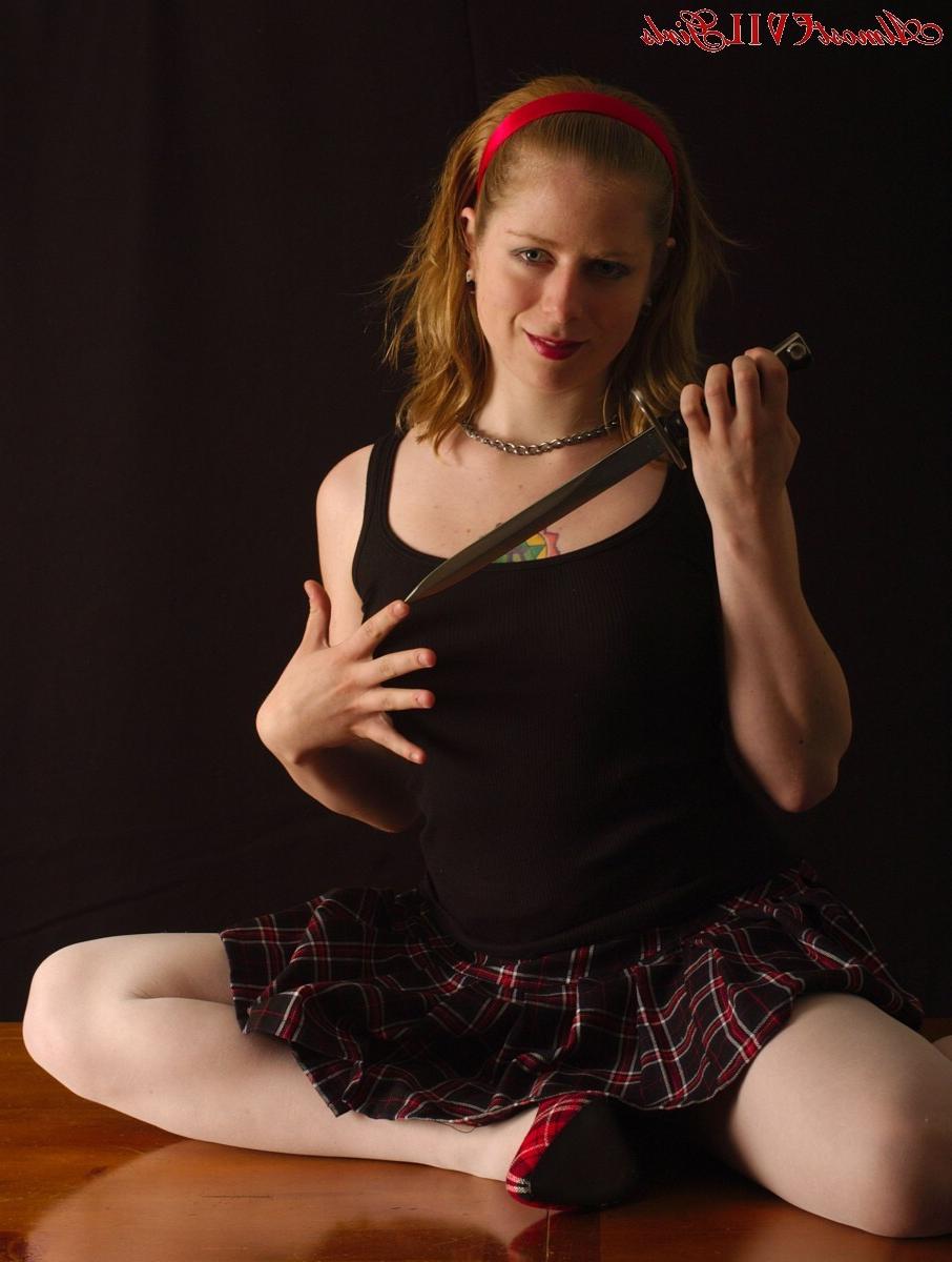 15P Leila Hazlett cuts off her top[ and slices up her stockings to show off her tigh