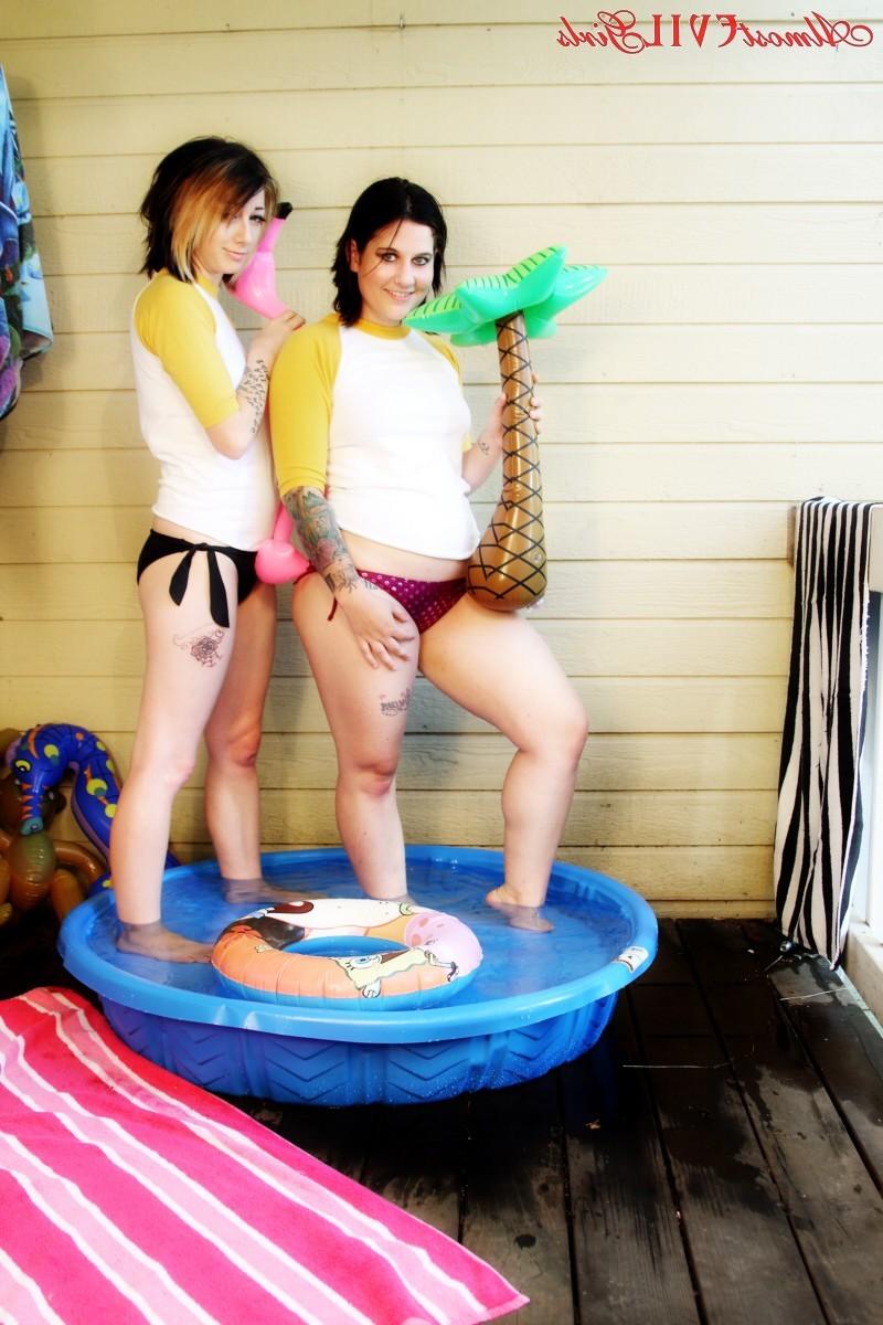 15P Angel Beau and Green Eyed get all wet and naked in a small pool outside