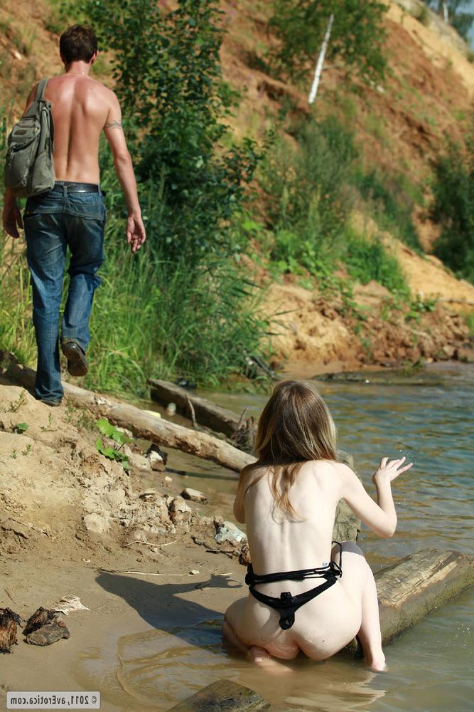 15P Pale natural blonde babe posing naked on the river