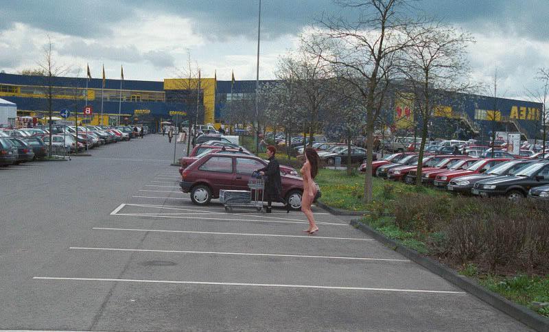 20P Busty gal walks nude at parking lot