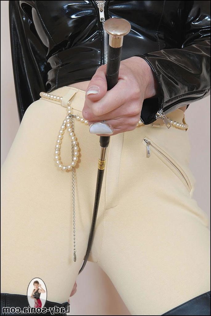 15P Mature kinky lady teasing with a whip in jodphurs