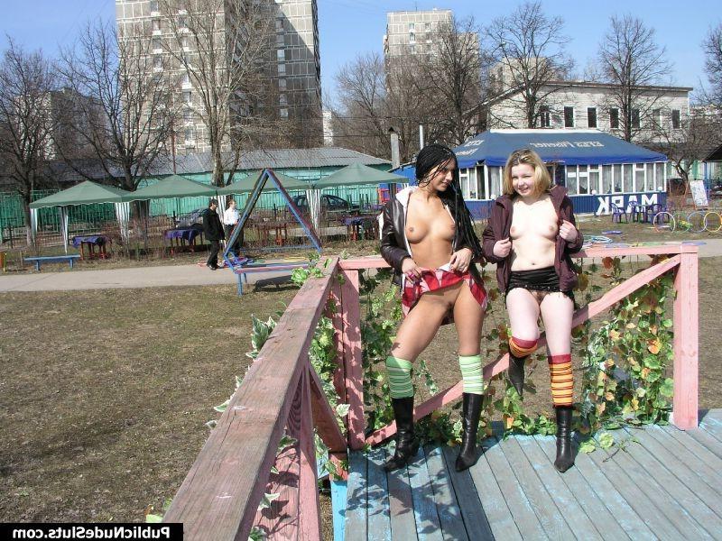 15P Two naughty babes displaying their seductive intimate spots in public