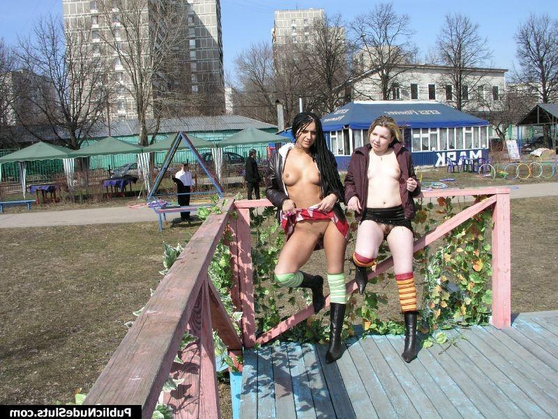 15P Two naughty babes displaying their seductive intimate spots in public