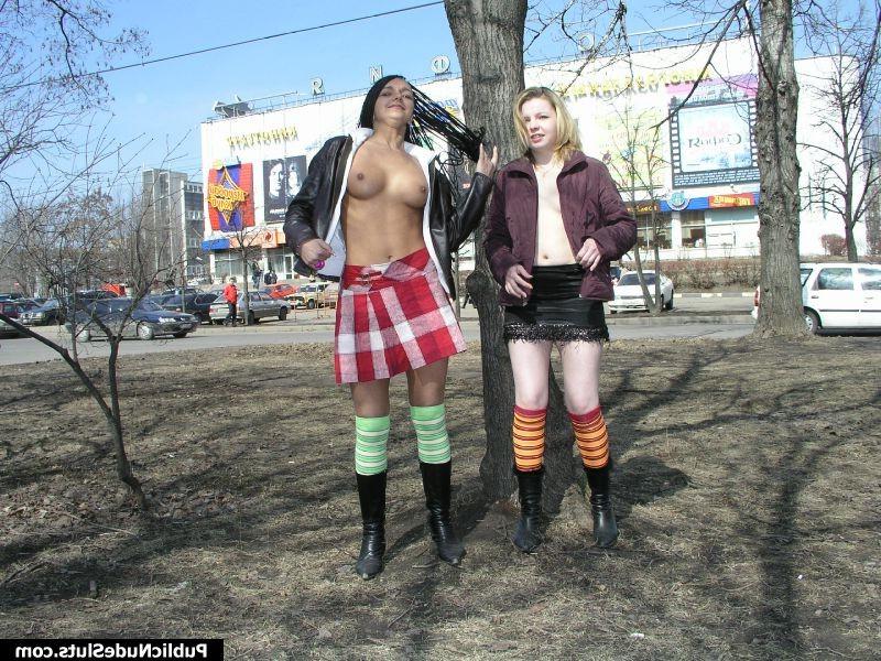 15P Two naughty babes displaying their seductive intimate spots in public