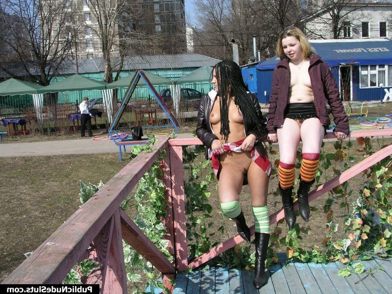 15P Two naughty babes displaying their seductive intimate spots in public