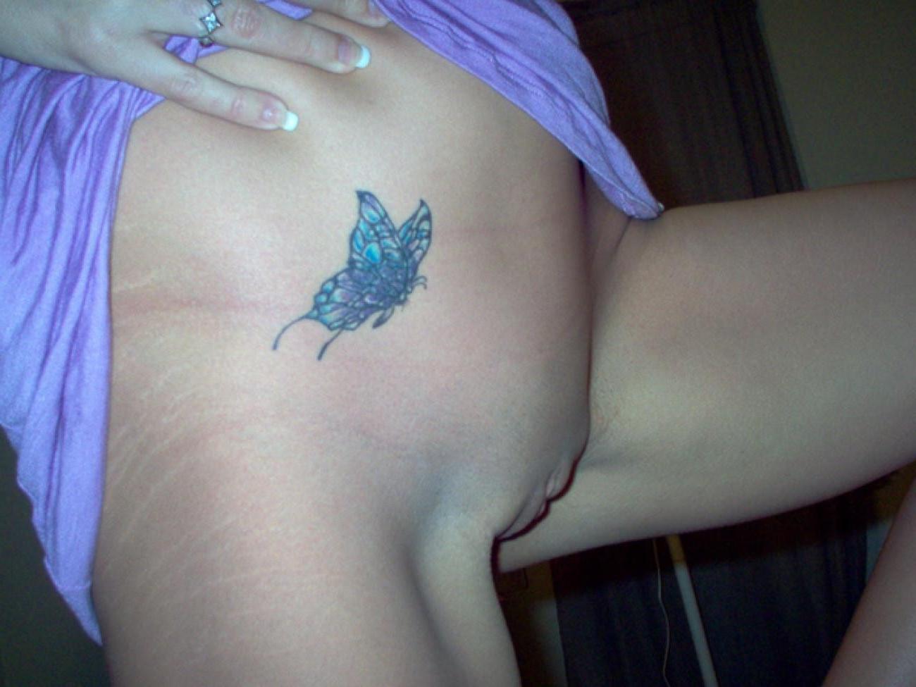 15P Pictures of a tattooed housewife posing and sucking cock