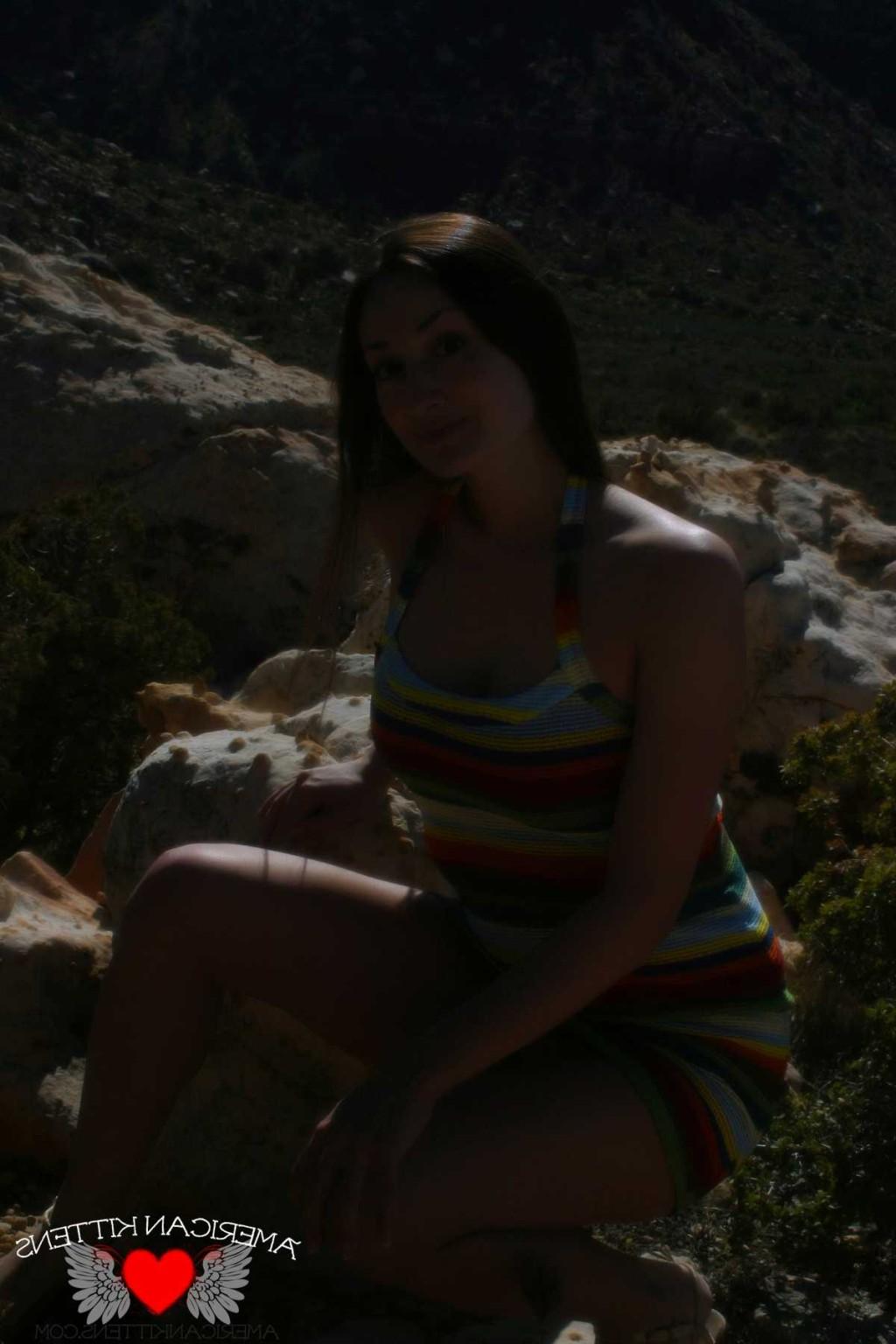 18P Emma outside crazy dress only in Vegas can you see a girl in this thing hiking