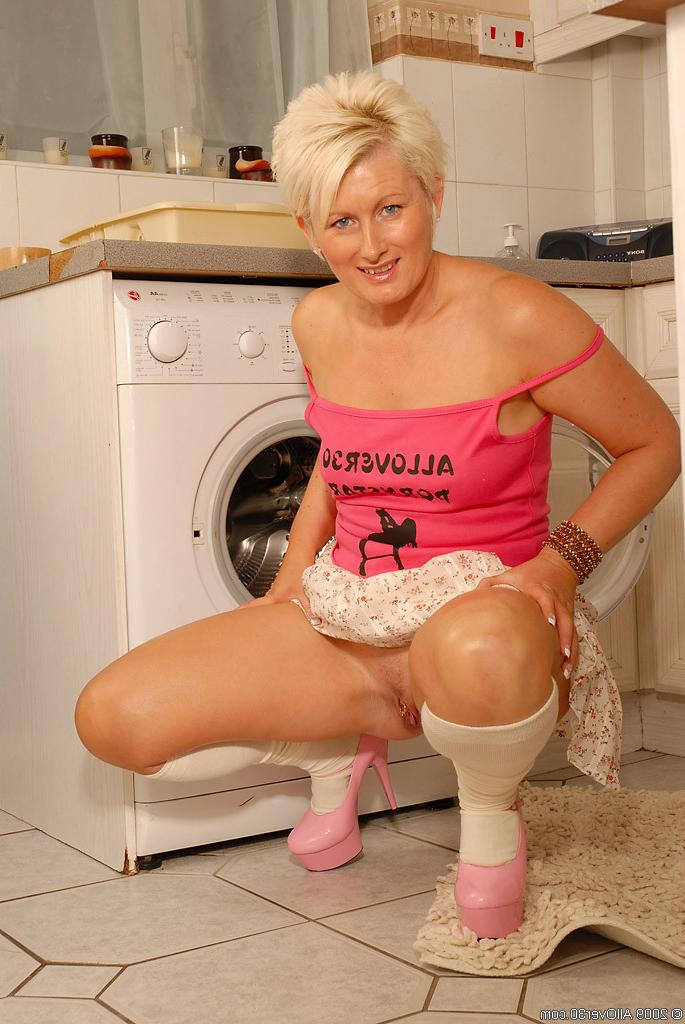 15P Blonde Sally plays with her pierced pussy