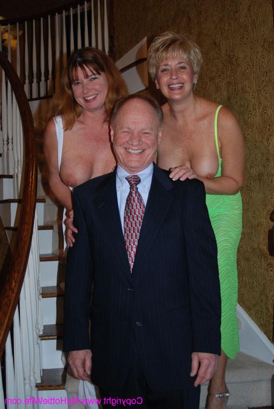 15P A blonde swinger milf showing her goods on a stairway