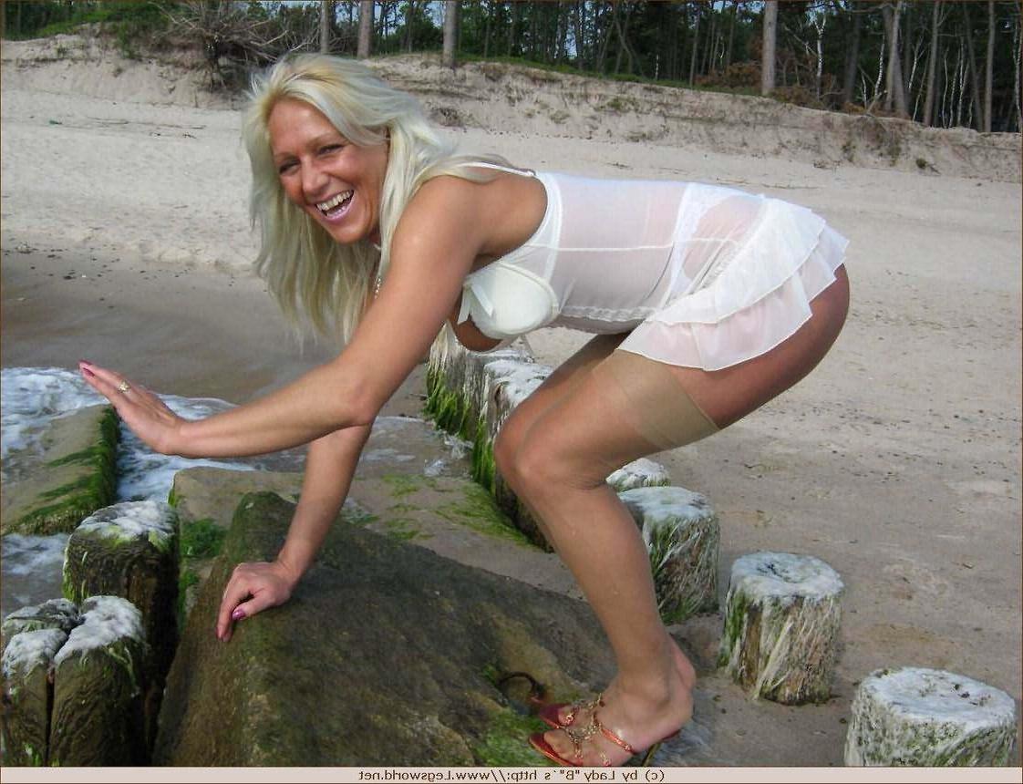 12P Leggy german amateur lady in nylons posing on the beach