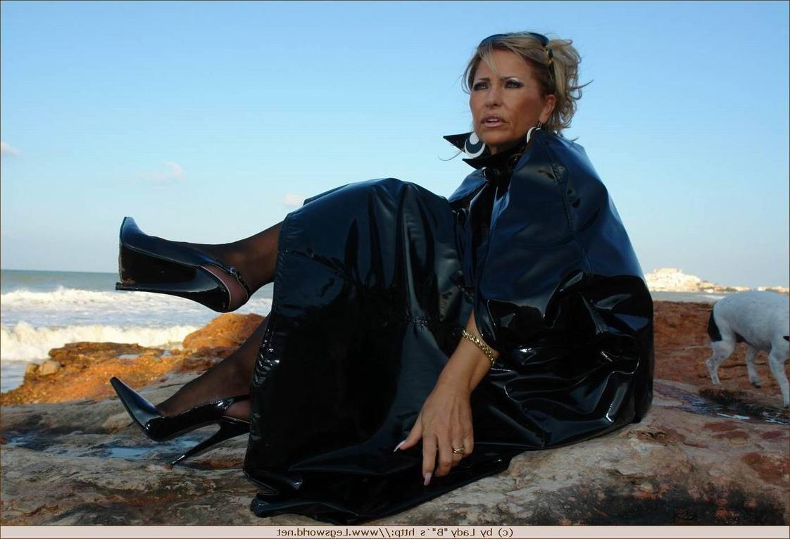 12P Elegant lady in black stockings poses on the beach