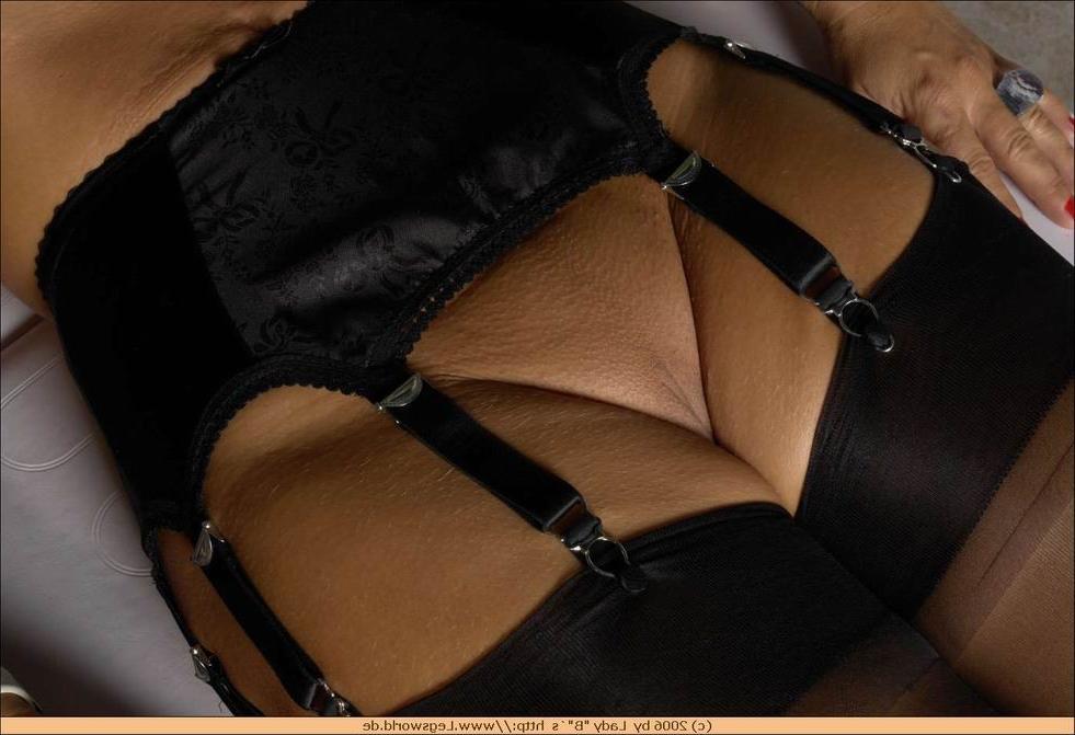 12P Busty german lady in black stockings