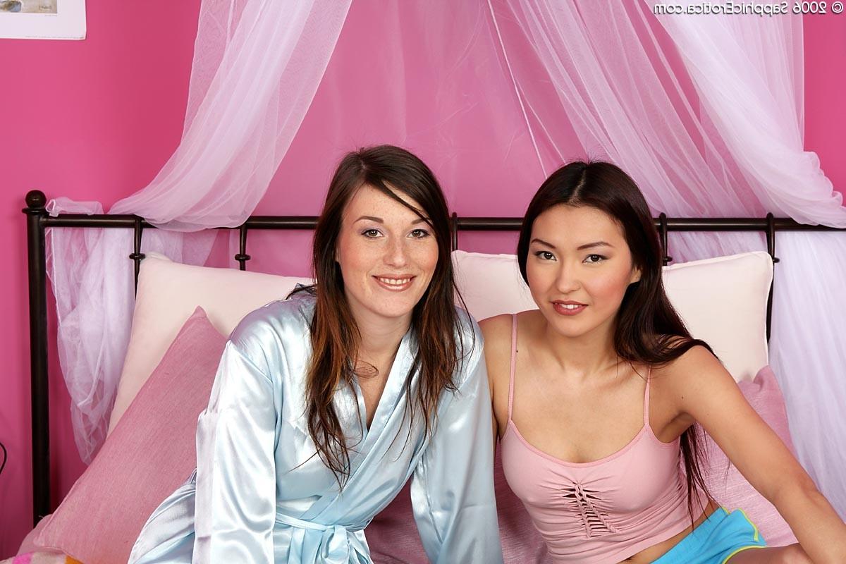 20P Two naughty teen lesbian babes having wild sex on the canopy bed