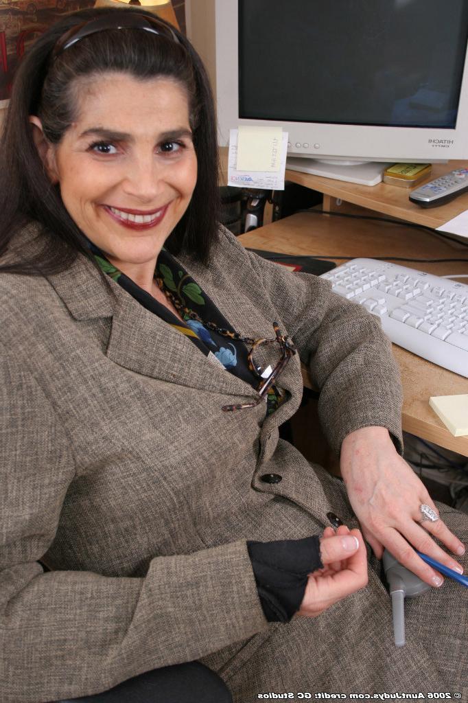 15P Mature secretary with big boobs in black stockings
