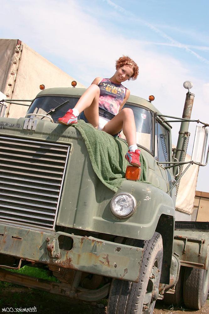 18P Gorgeous redhead teen spreads her tight pink pussy on a truck