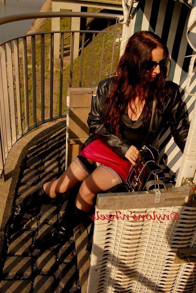 12P Redhead Justine in nylons and boots having a smoke