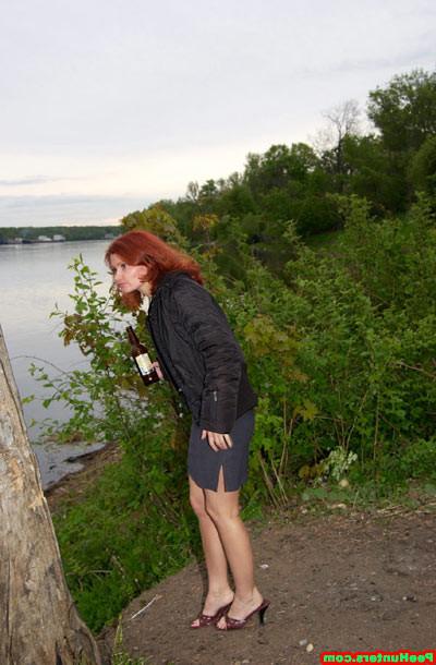 15P Redhead slut peeing near river after beer drinking