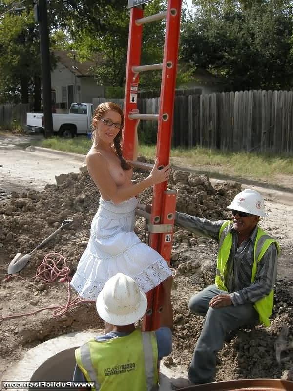 16P Redhead in glasses flashing for grinning work crew