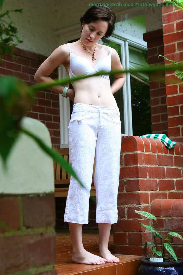 16P Spying on slim brunette getting dressed outdoors on a porch