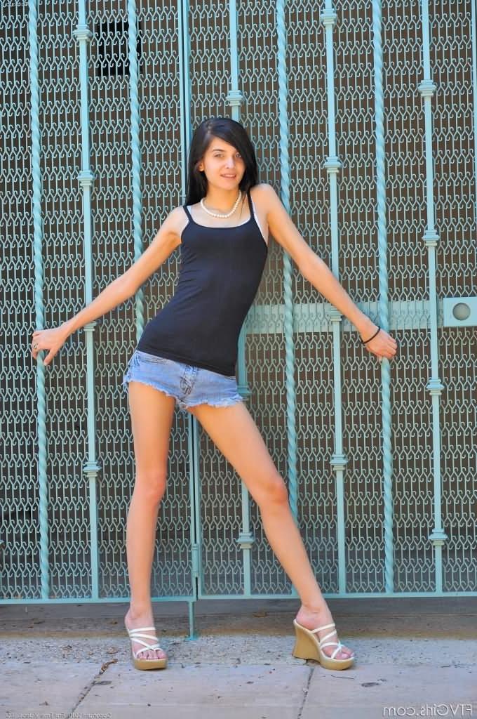 16P Cute brunette teen showing her tits and fingering pink pussy