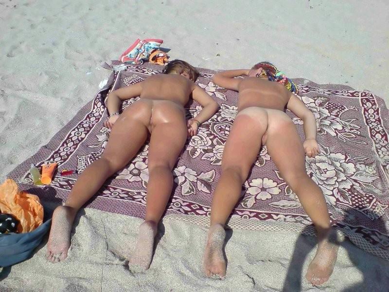 12P Nude nudists relaxing on the beach