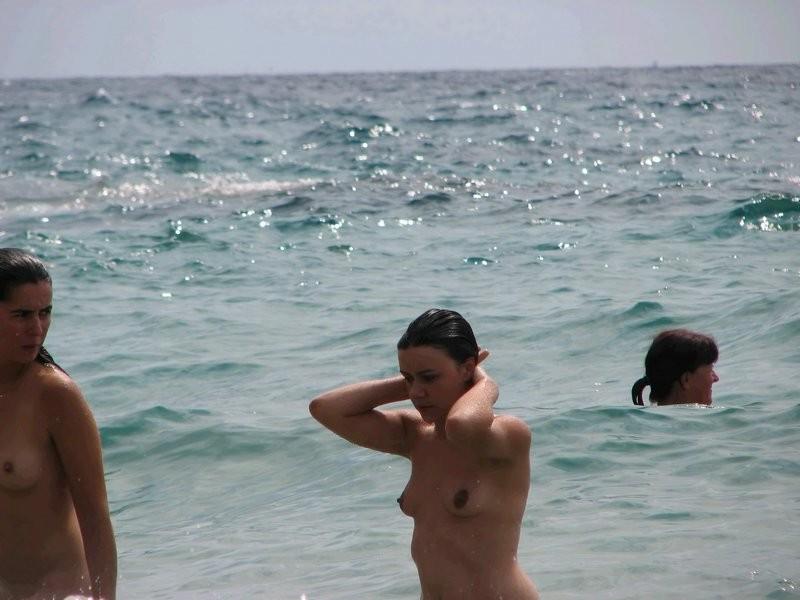 12P Lots of naked next door people on beach
