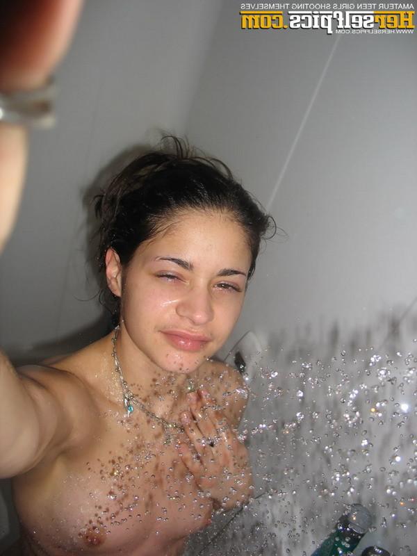 16P Cute teen showering showing her tight shaved young pink pussy